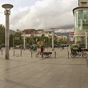 Panorama showing the Potala Palace in the distance and a department store on a modern high street