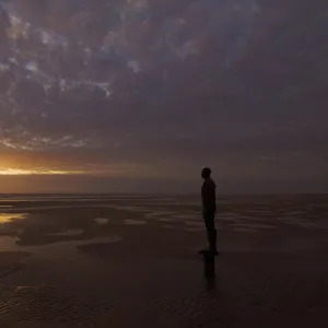 Another Place statues by artist Antony Gormley on Crosby beach, Merseyside