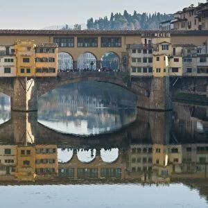 Ponte Vecchio reflected in the River Arno, Florence, UNESCO World Heritage Site