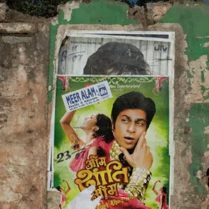 Shahruk Khan in torn Bollywood movie poster on wall, Hospet, Karnataka, India, Asia