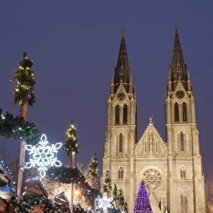 Stalls of the Christmas Market, Christmas tree and Neo-Gothic St. Ludmilla Church