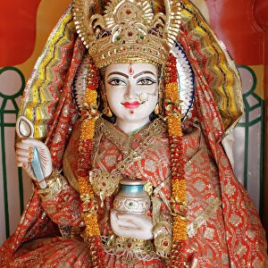 Statue of the Hindu goddess Annapurna (Parvati) giving food, Lakshman temple