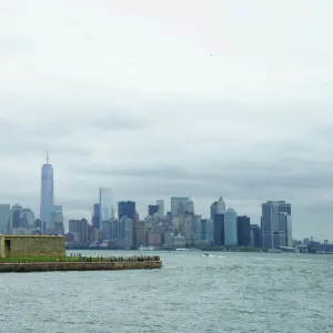 Statue of Liberty with the Lower Manhattan skyline and One World Trade Center beyond, New York City, New York, United States of America, North America