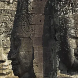 Stone statuary of human faces, Ta Prohm temple, Angkor, UNESCO World Heritage Site