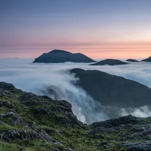 Sunrise behind Bla Bheinn and Marsco with an early morning inversion filling Glen