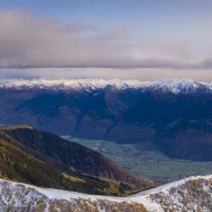 Sunset on the autumnal landscape of Scermendone Alp and Orobie Alps, aerial view by drone