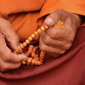 Tibetan monk holding prayer beads, Nepal, Asia