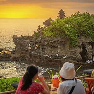Tourists at Tanah Lot, traditional Balinese temple at sunset, Beraban, Kediri, Tabanan Regency, Bali, Indonesia, South East Asia, Asia