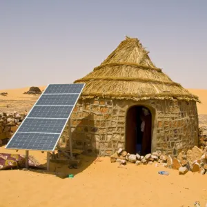 Traditional house with a solar panel in the Sahara Desert, Algeria, North Africa, Africa