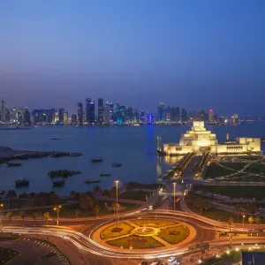 Traffic at roundabout in front of the Museum of Islamic Art at night, Doha, Qatar, Middle East