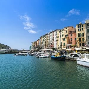 The turquoise sea frames the typical colored houses of Portovenere, UNESCO World Heritage Site