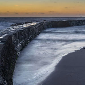 Tynemouth Pier, as seen from Cullercoats at dawn, Tyne and Wear, England, United Kingdom