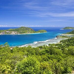 View across Anse l Islette to the offshore islands of Therese and Conception from hillside above Port Glaud, Port Glaud district, Island of Mahe, Seychelles, Indian