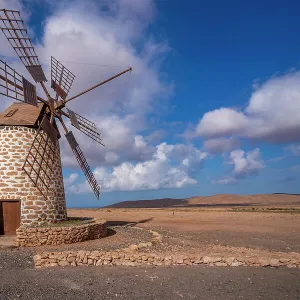 View of traditional windmill and landscape on a sunny day, La Oliva, Fuerteventura, Canary Islands, Spain, Atlantic, Europe