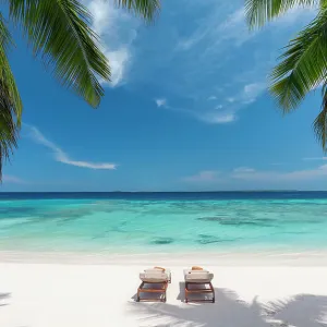 Wooden lounge chairs on a beautiful tropical beach, The Maldives, Indian Ocean, Asia