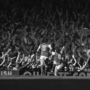 Arsenals Charlie Nicholas celebrates in front of the North Bank