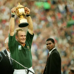 Francois Pienaar lifts the World Cup for South Africa as Nelson Mandela cheers