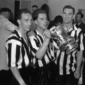 Jackie Milburn and his Newcastle United teammates celebrate their 1955 FA Cup victory