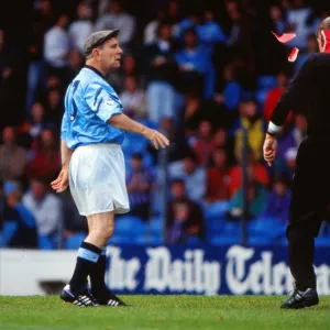 Norman Wisdom throws red cards at a referee