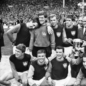 West Ham manager Ron Greenwood celebrates victory with his players after the 1964 FA Cup Final