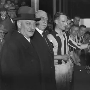 William Cuff presents WBA reserve captain Bob Finch with the Central League trophy in 1933