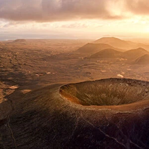 Aerial panoramic of Calderon Hondo volcanic crater at sunrise, Corralejo, Fuerteventura