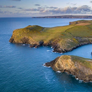 Aerial vista of Doyden Castle on the headland at Port Quin, Cornwall, England