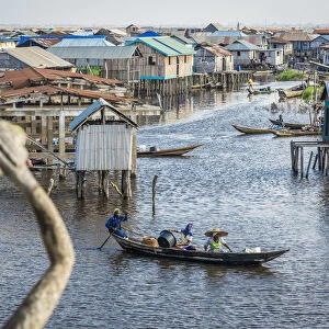 Africa, Benin, Ganvie. View over the channel with stilt houses and canoes