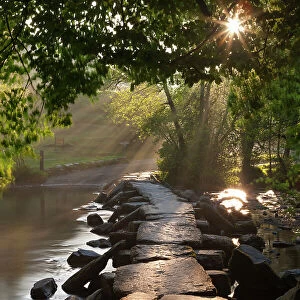 Ancient clapper bridge Tarr Steps spanning the River Barle in Exmoor, Somerset, England