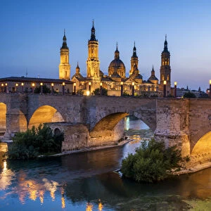 Basilica-Cathedral of Our Lady of the Pillar & Roman Bridge Over Ebro River at Dusk