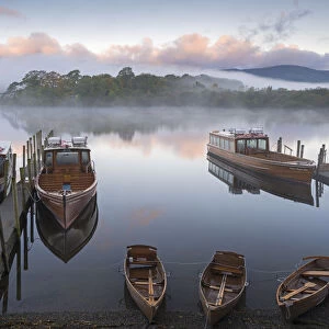 Boats on Derwent Water on a misty autumn morning, Lake District National Park, Keswick