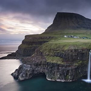 Dramatic coastal scenery at Gasadalur on the island of Vagar, Faroe Islands. Spring