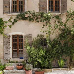 The facade of an old house in Oppede le Vieux in Provence France
