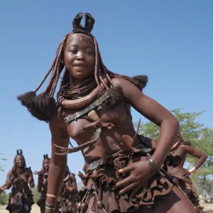 Himba women perform the otjiunda dance