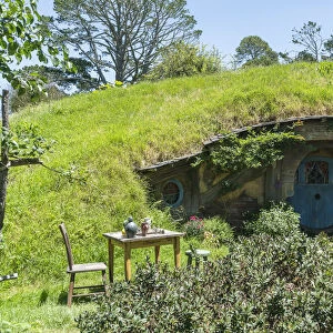 Hobbit house with table and chair in the garden