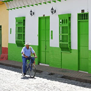 Man on bike in streets of Santa Fe de Antioquia, Colombia, South America