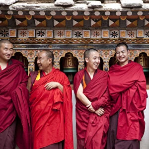 Monks in the Bhuddist temple or Dzong in Paro Bhutan