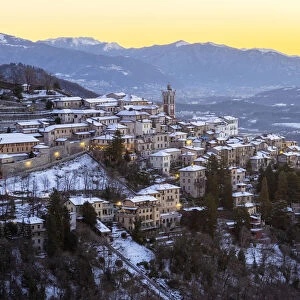 Morning view of the town of Santa Maria del Monte after a snowfall in winter from the