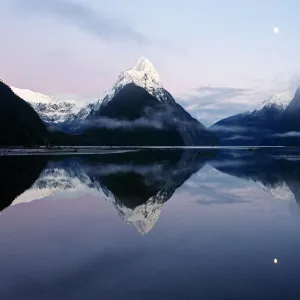 New Zealand, Nuova Zelanda, Fiordland, Milford Sound and moon during a cold and misty