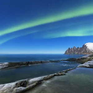 Northern lights above the bay facing Tungeneset. Tungeneset, Ersfjorden, Senja, Norway