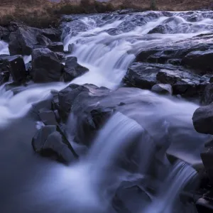 The river Allt Dearg Mor tumbling over a series of waterfalls in Glen Sligachan, Isle of Skye