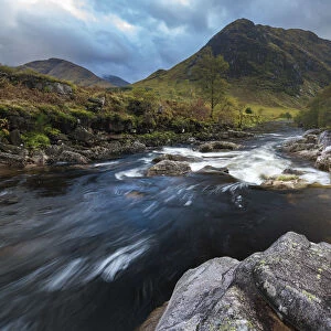 River Etive stream flowing through rocks in Glen Coe, Highland Region, Scotland, United