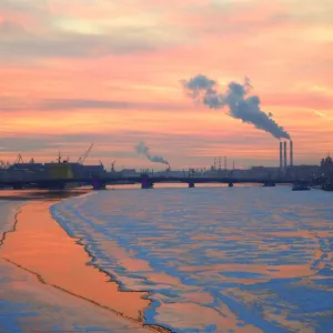 Russia, St. Petersburg; The last light over the partly frozen Neva River with in Winter