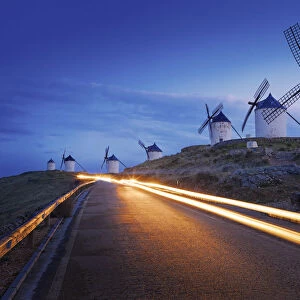 Spain, Castile, La Mancha, Consuegra, Windmills at dusk