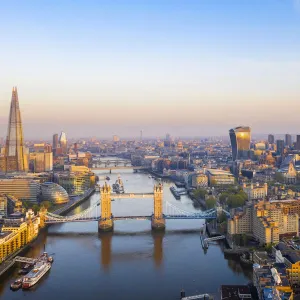 Sunrise looking down the river Thames to Tower Bridge, the Shard and city, London