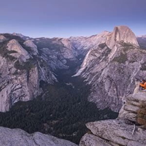 Tourists viewing Half Dome and Yosemite Valley from Glacier Point, Yosemite National Park