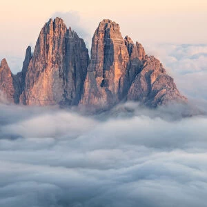 Tre Cime di Lavaredo emerging from the clouds, Sexten Dolomites, South Tyrol, Bolzano