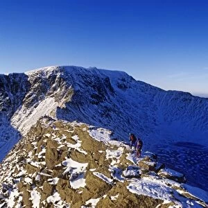 Winter walking and climbing on Hellvelyn, The Lake District, Cumbria