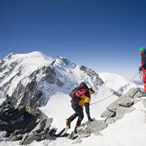 Climbers on the summit of the 4000 metre peak of Mont Blanc Du Tacul above Chamonix France