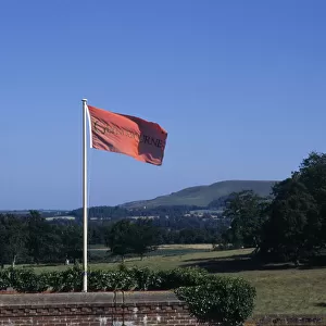ENGLAND, East Sussex, Glyndebourne Red flag in the grounds of the country house